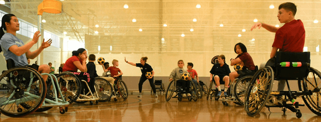 Players in wheelchairs during a korfball session