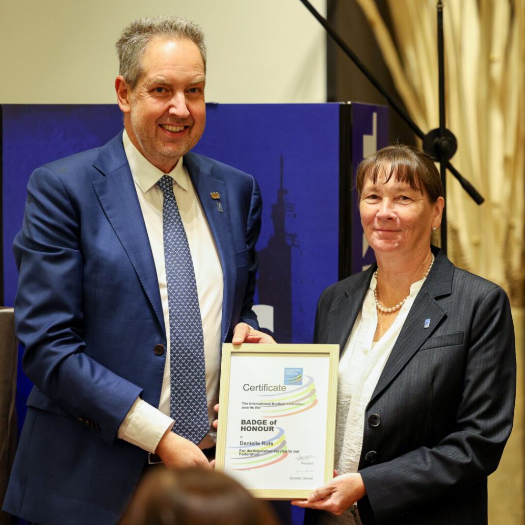 Jan Fransoo awards IKF Badge of Honour to Danielle RUTS. Photo: Krit Suttipithuk